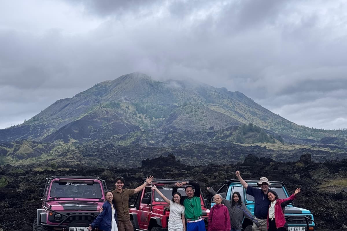 Tour group beside their jeeps at Mount Batur